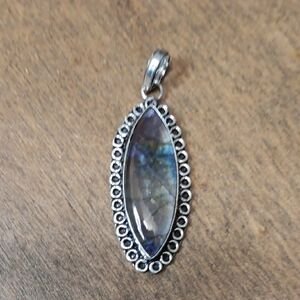 Elegant Silver Pendant with Iridescent Stone